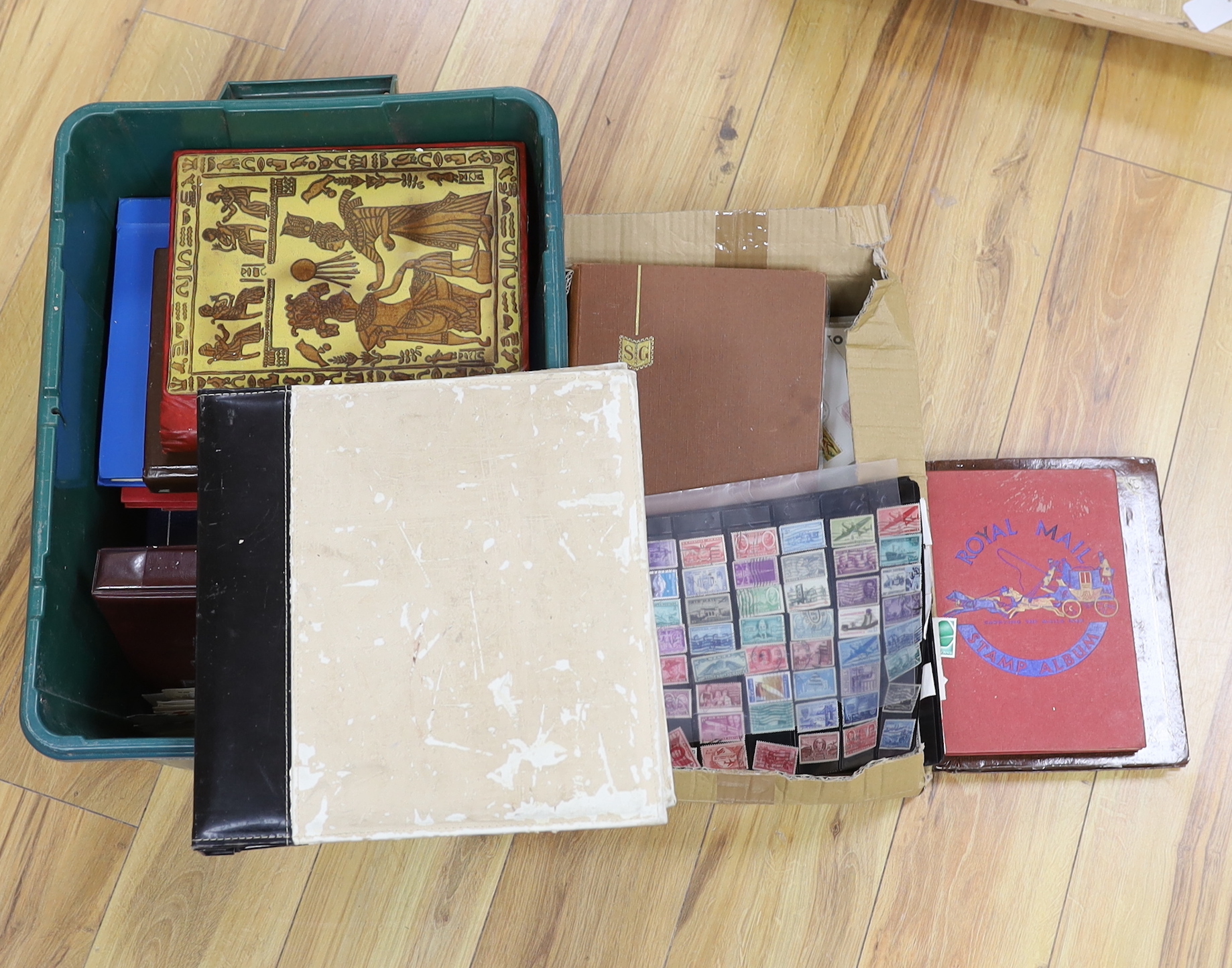 A collection of stamps and cigarette cards in two boxes